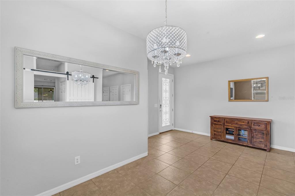 1641 Regal River Circle Ocoee, FL 34761 - Photo 9 of 42 a view of a livingroom with a chandelier fan and furniture