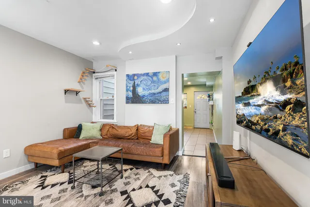 a living room with furniture and a rug
