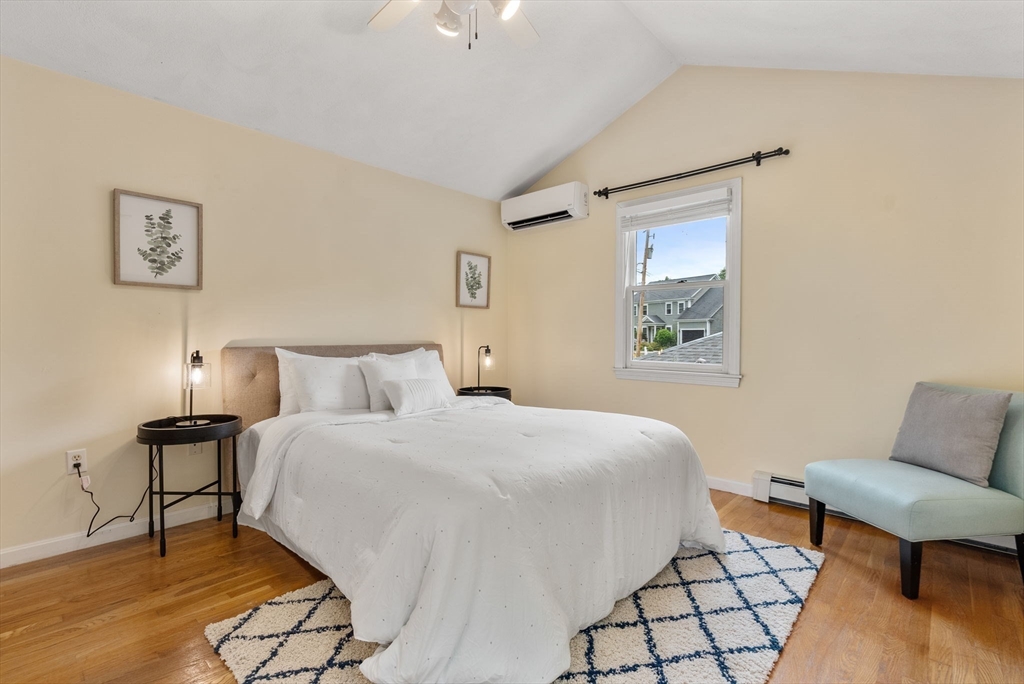 226 Pine Hill Circle Waltham, MA 02451 - Photo 14 of 28 a bedroom with a bed and a couch