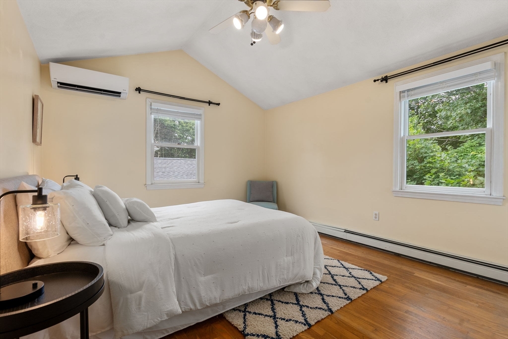 226 Pine Hill Circle Waltham, MA 02451 - Photo 15 of 28 a bedroom with a bed and a table