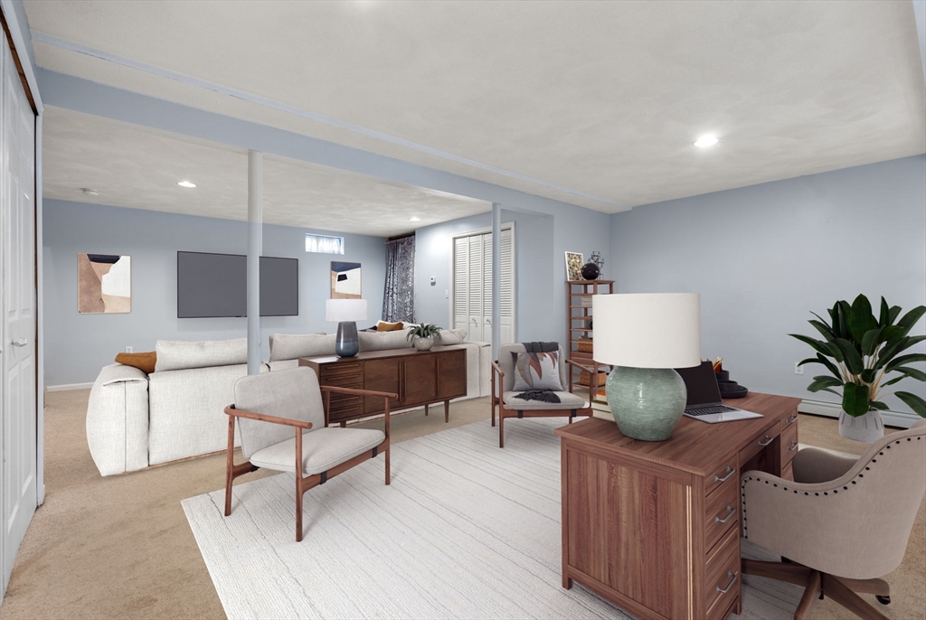 226 Pine Hill Circle Waltham, MA 02451 - Photo 22 of 28 a living room with furniture and a potted plant on table