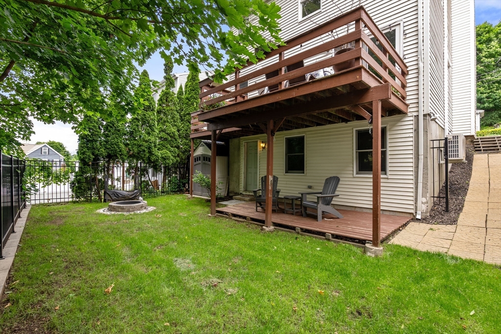 226 Pine Hill Circle Waltham, MA 02451 - Photo 25 of 28 a view of a chair and table in backyard of the house
