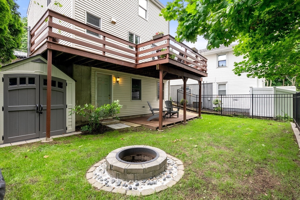 226 Pine Hill Circle Waltham, MA 02451 - Photo 27 of 28 a view of a house with backyard porch and sitting area