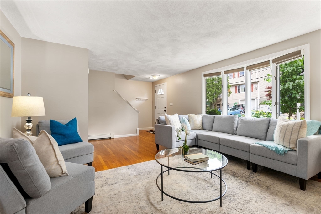 226 Pine Hill Circle Waltham, MA 02451 - Photo 4 of 28 a living room with furniture and a large window