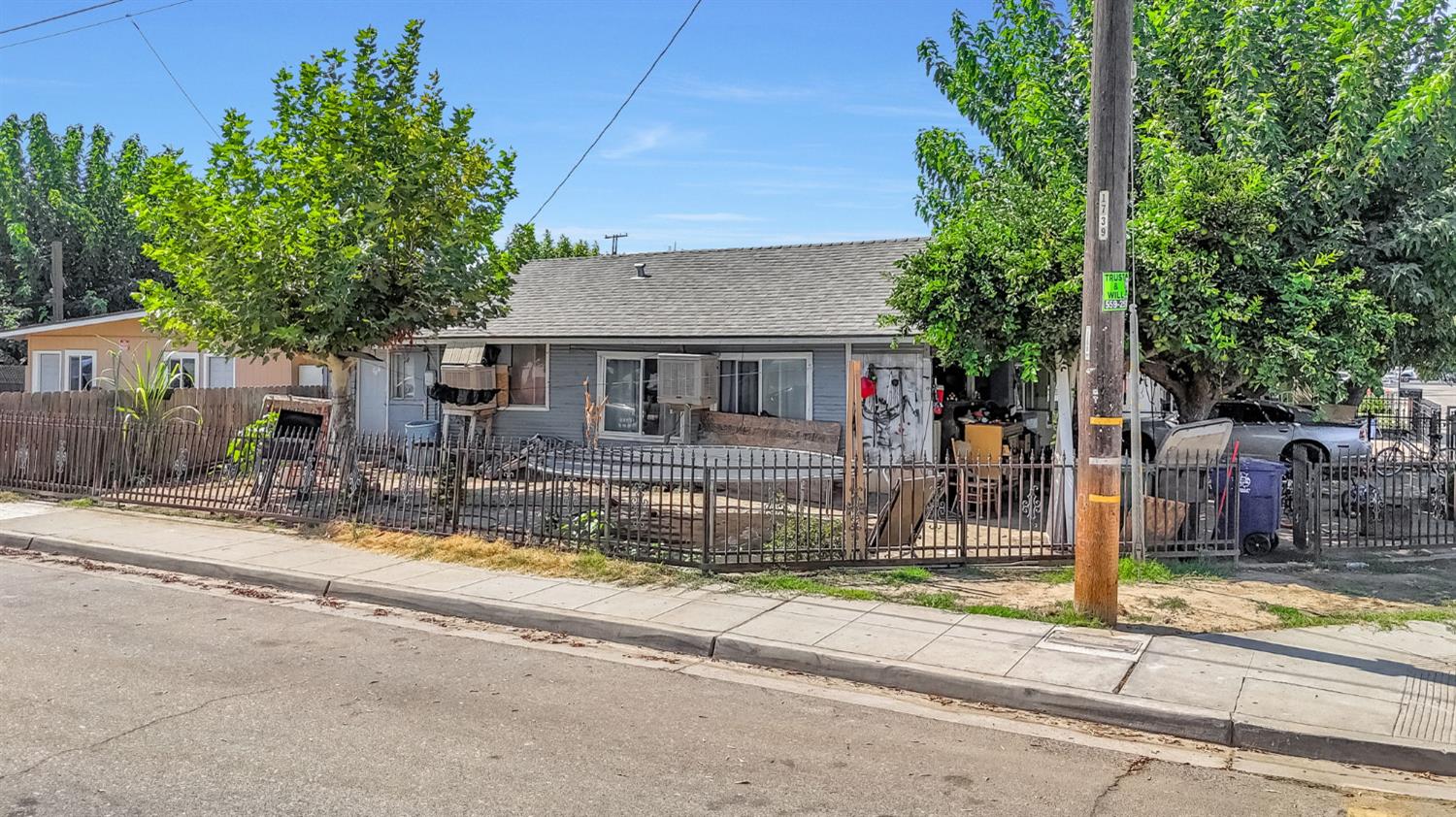 255 J Street Parlier, CA 93648 - Photo 11 of 19 a view of a house with a patio and a yard