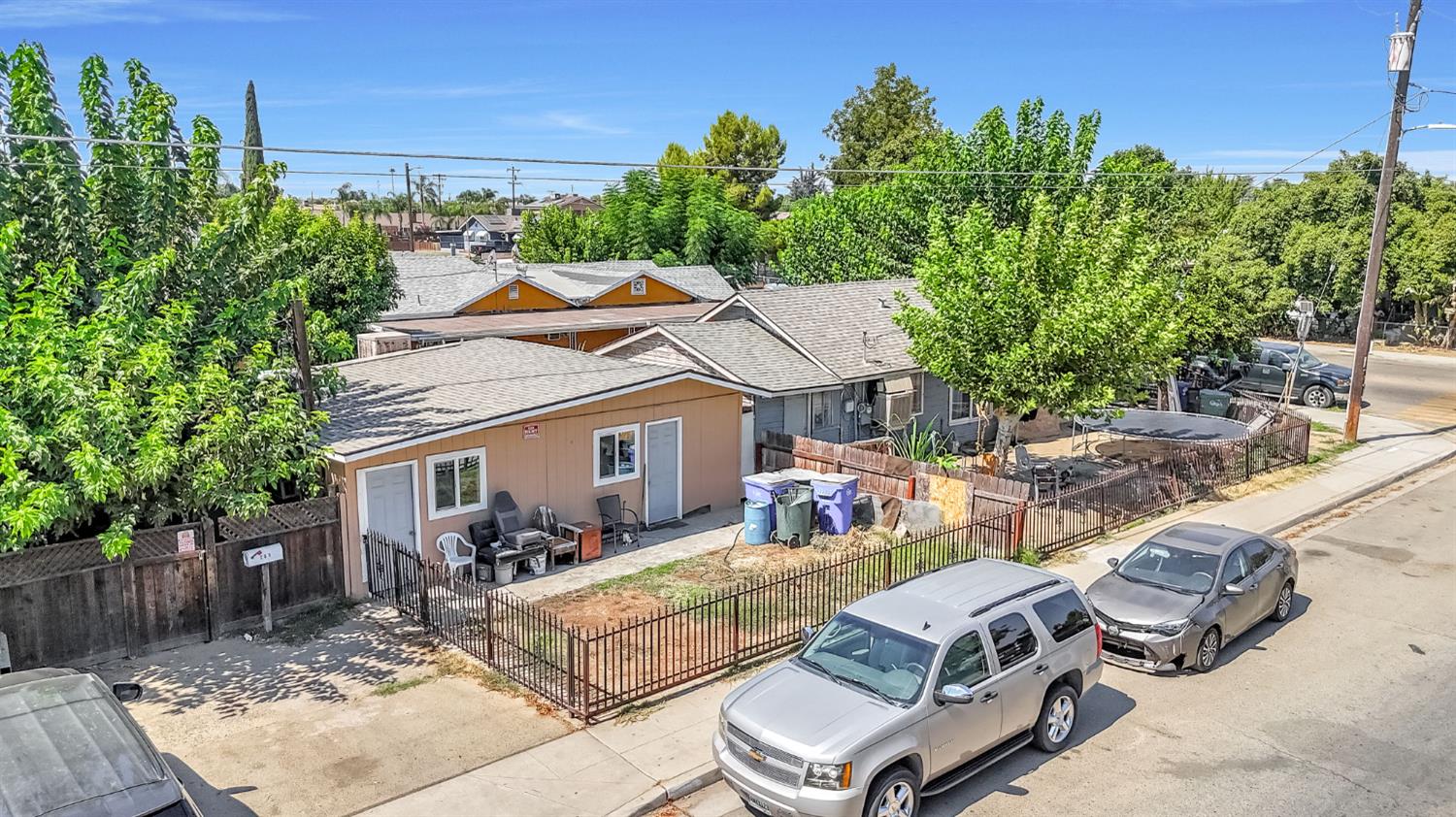 255 J Street Parlier, CA 93648 - Photo 15 of 19 a view of a patio with couches table and chairs and potted plants