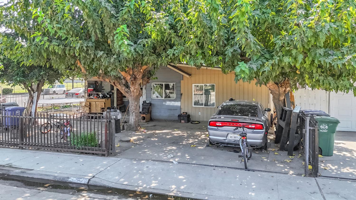 255 J Street Parlier, CA 93648 - Photo 17 of 19 a house view with a sitting space and garden