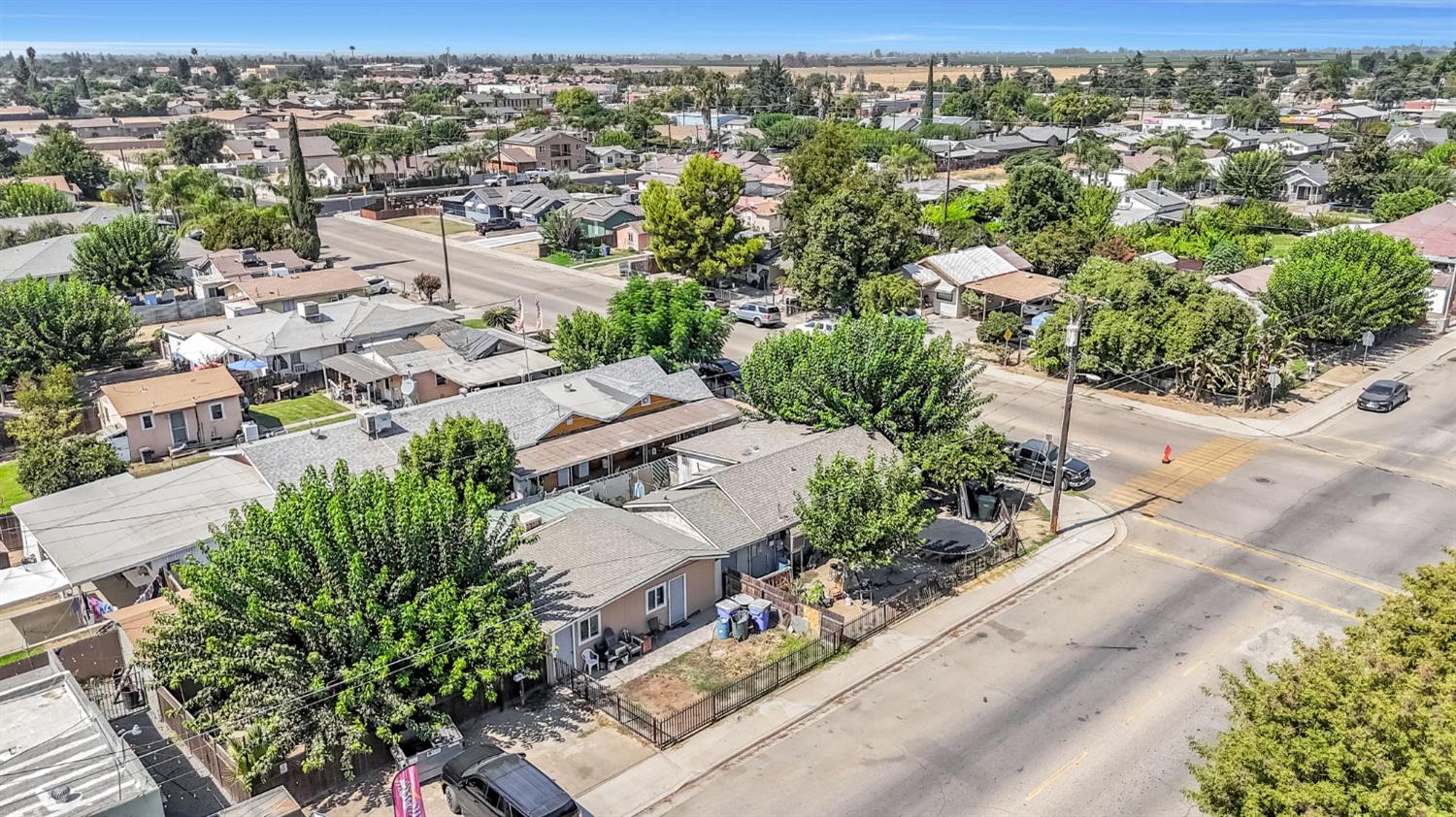 255 J Street Parlier, CA 93648 - Photo 7 of 19 an aerial view of residential houses with outdoor space