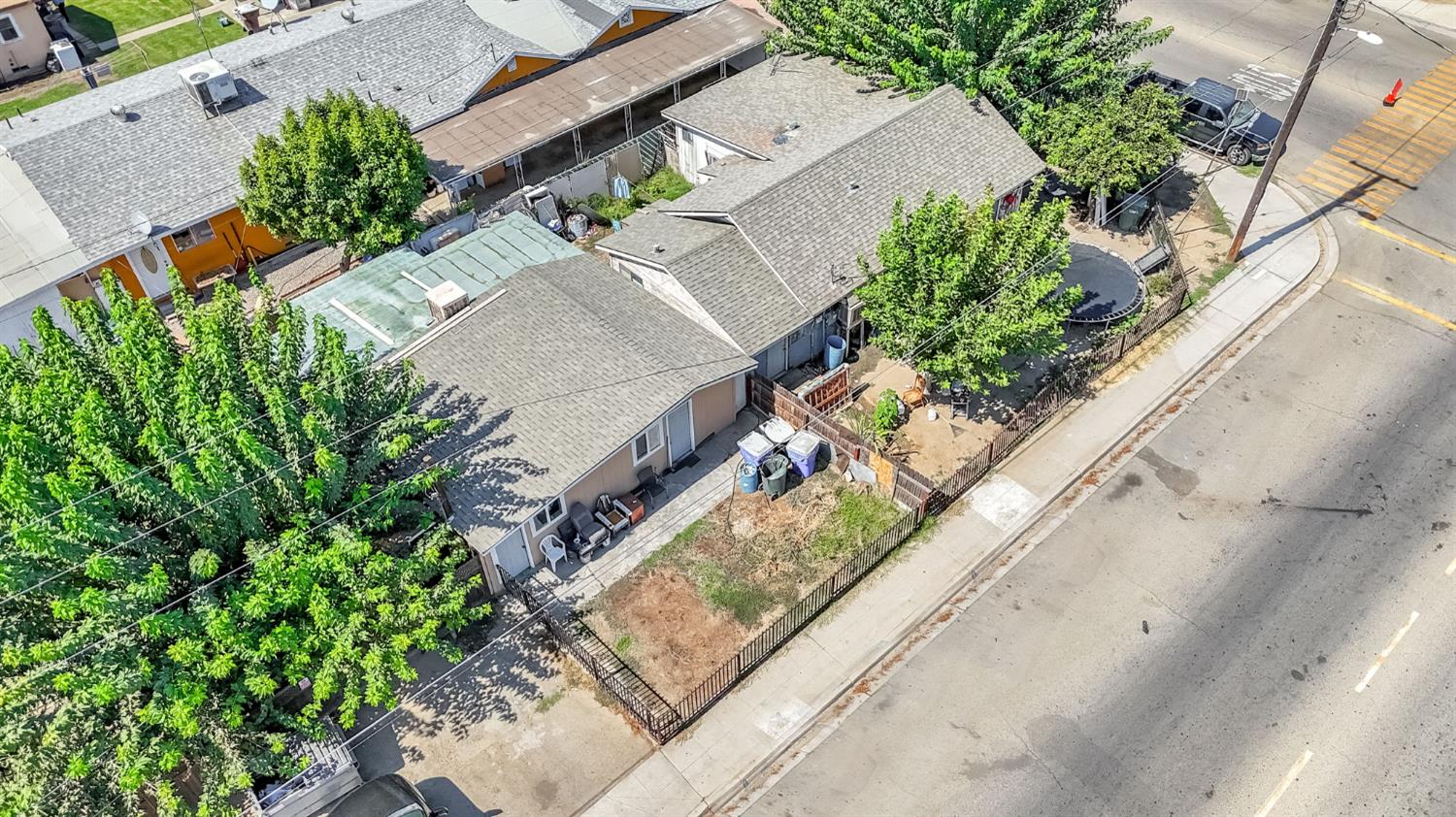 255 J Street Parlier, CA 93648 - Photo 8 of 19 an aerial view of a residential houses with yard
