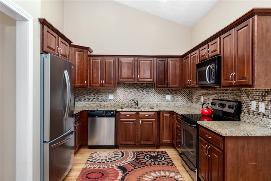 145 Smithfield Road, Unit B North Providence, RI 02904 - Photo 6 of 21 Stainless appliances, cherry cabinets, Italian glass back splash