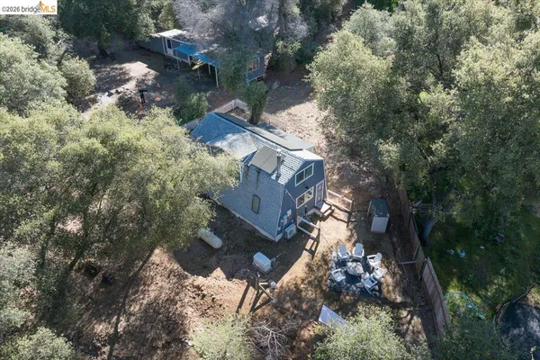 an aerial view of residential house with outdoor space
