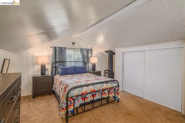 a bedroom with a bed and furniture