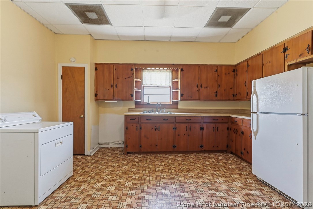 249 Nicholson Road Rockingham, NC 28379 - Photo 24 of 47 a kitchen with a refrigerator and a sink