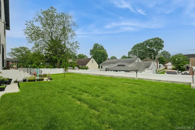 a view of a garden with lawn chairs