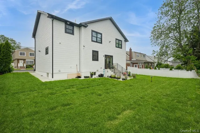 a view of an house with backyard space and garden