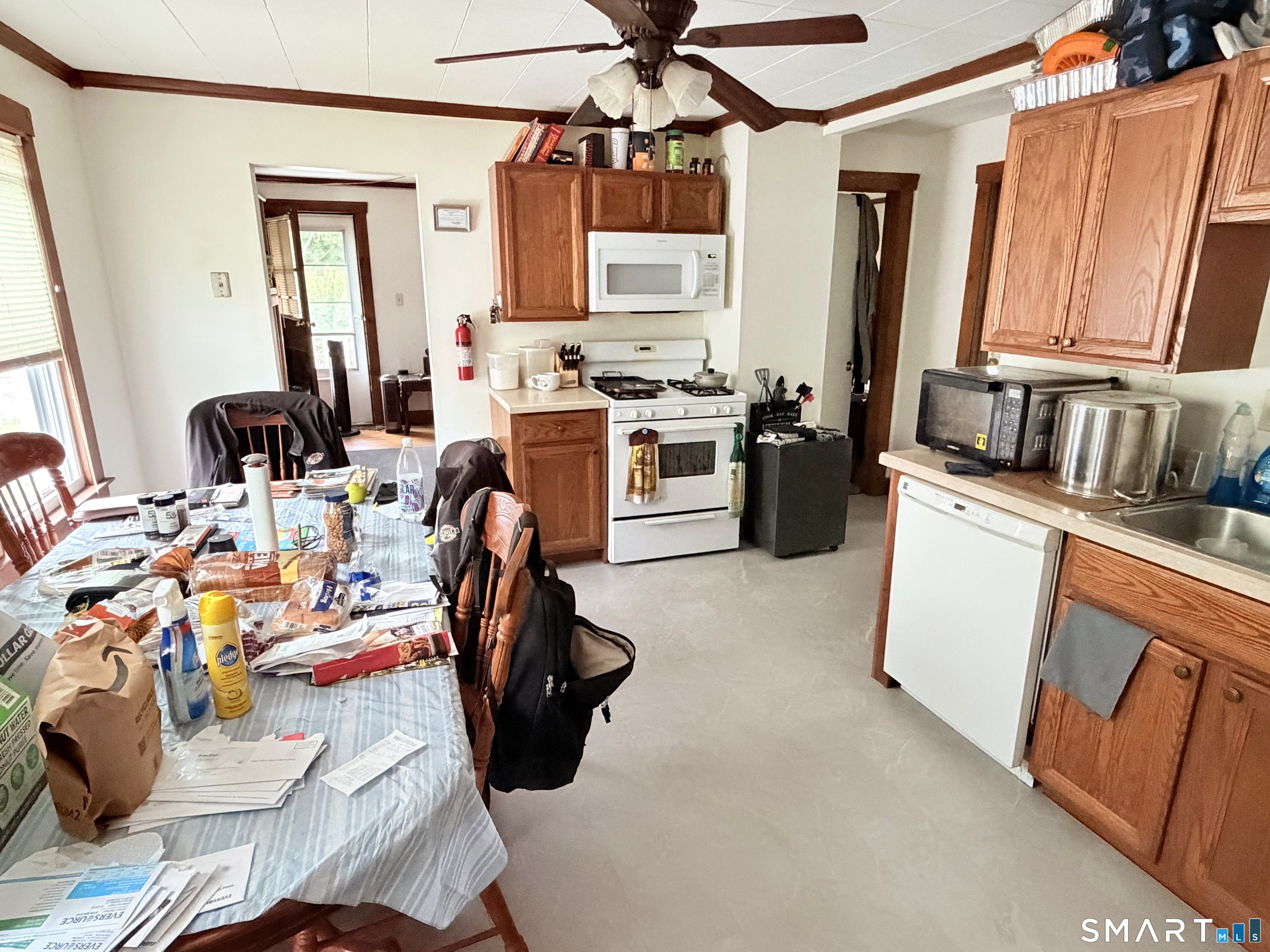 67 Pine Street Meriden, CT 06451 - Photo 17 of 34 a view of a kitchen with fridge and workspace