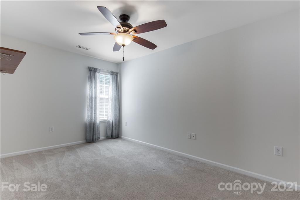 3002 Arthur Road Indian Land, SC 29707 - Photo 20 of 25 an empty room with windows and fan