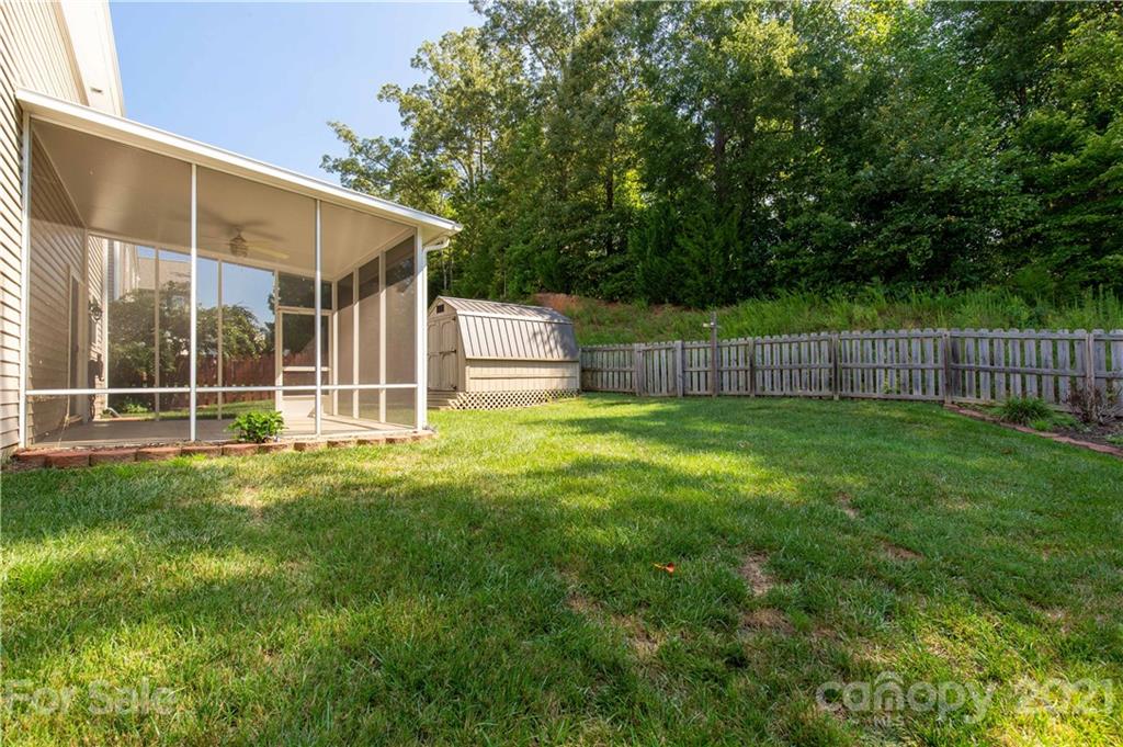 3002 Arthur Road Indian Land, SC 29707 - Photo 23 of 25 a view of a backyard with a garden and deck
