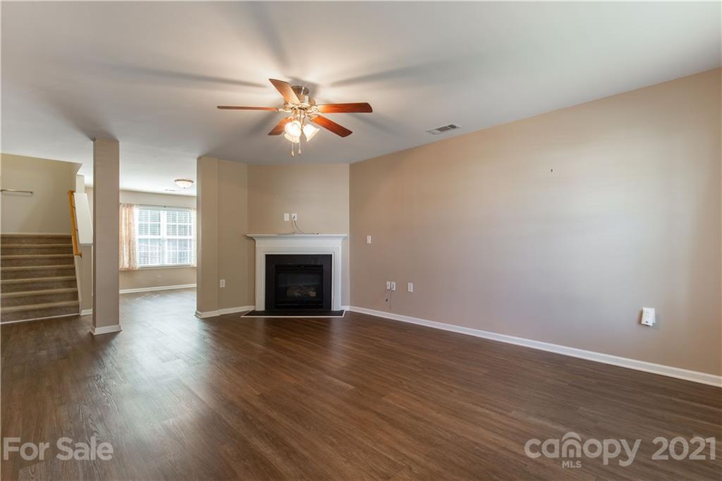 3002 Arthur Road Indian Land, SC 29707 - Photo 5 of 25 a view of empty room with wooden floor and fan