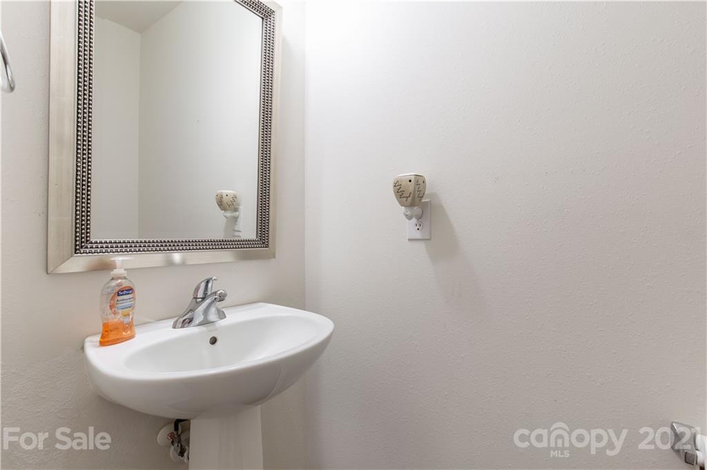 3002 Arthur Road Indian Land, SC 29707 - Photo 9 of 25 a bathroom with a sink a mirror and a toilet