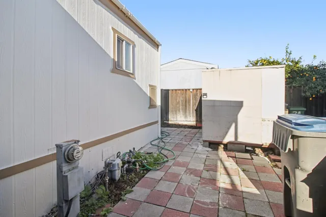 a view of a door and yard in back yard