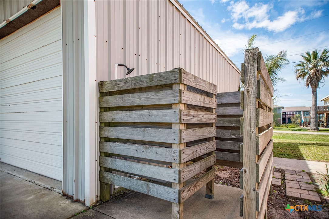 211 Taylor Avenue Port O'Connor, TX 77982 - Photo 14 of 43 a view of a wooden door and a yard