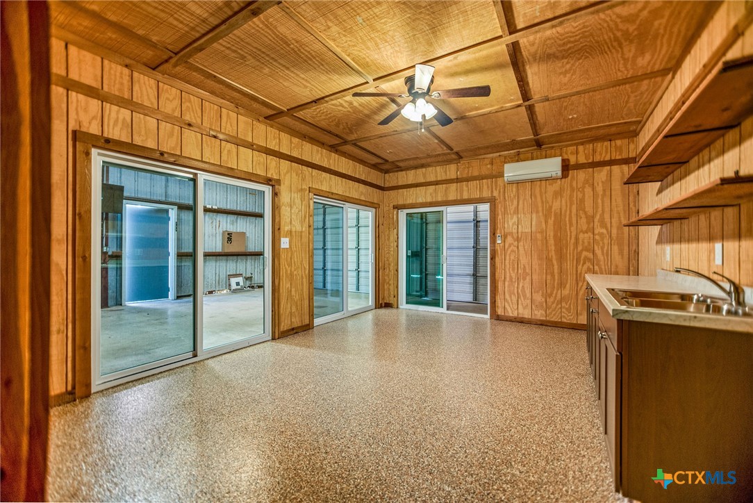 211 Taylor Avenue Port O'Connor, TX 77982 - Photo 18 of 43 a view of a room with floor to ceiling windows