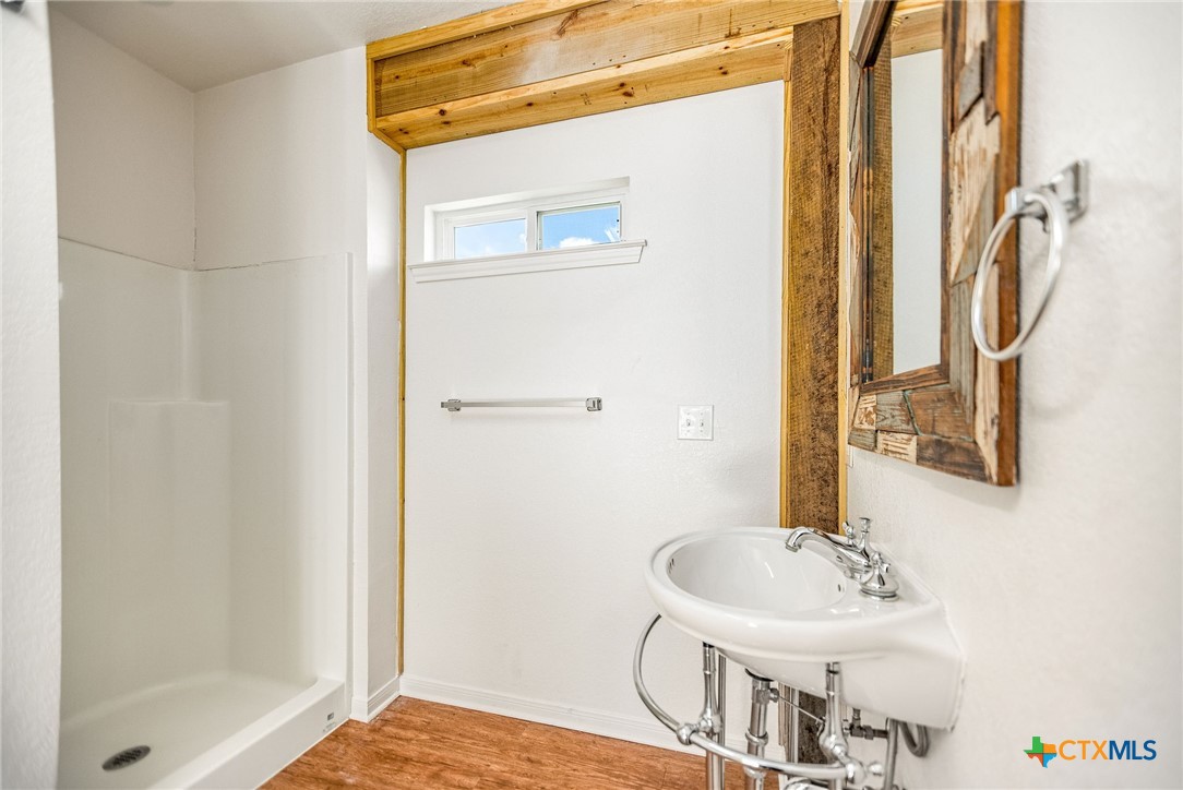 211 Taylor Avenue Port O'Connor, TX 77982 - Photo 20 of 43 a bathroom with a sink and a mirror