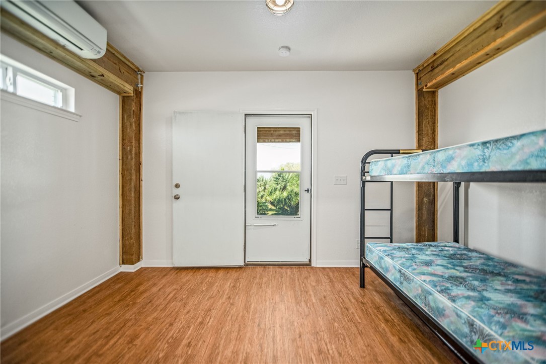 211 Taylor Avenue Port O'Connor, TX 77982 - Photo 22 of 43 a view of a room with wooden floor