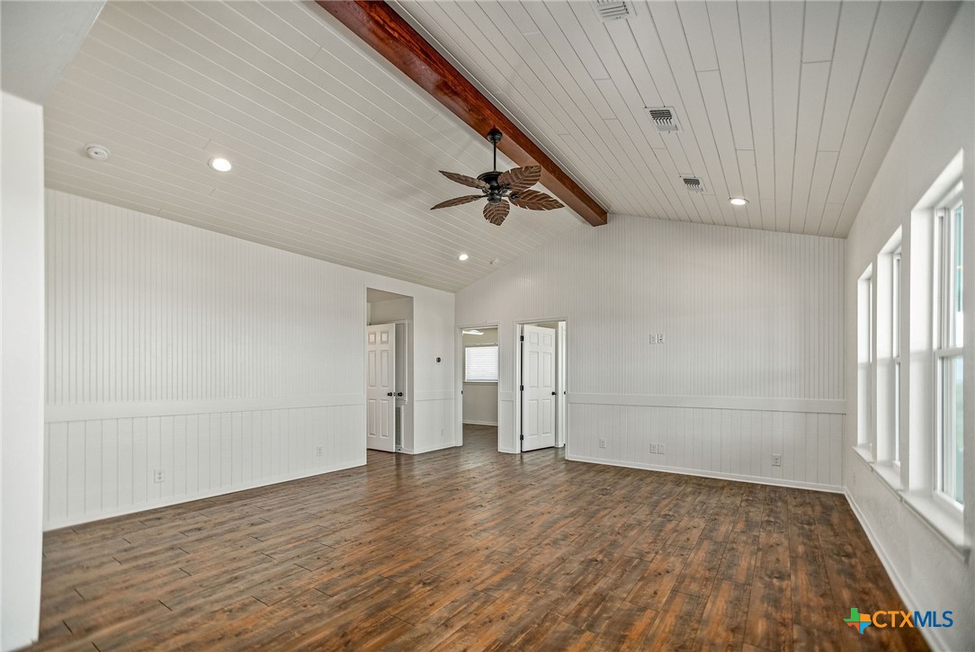 211 Taylor Avenue Port O'Connor, TX 77982 - Photo 26 of 43 wooden floor in an empty room with a window