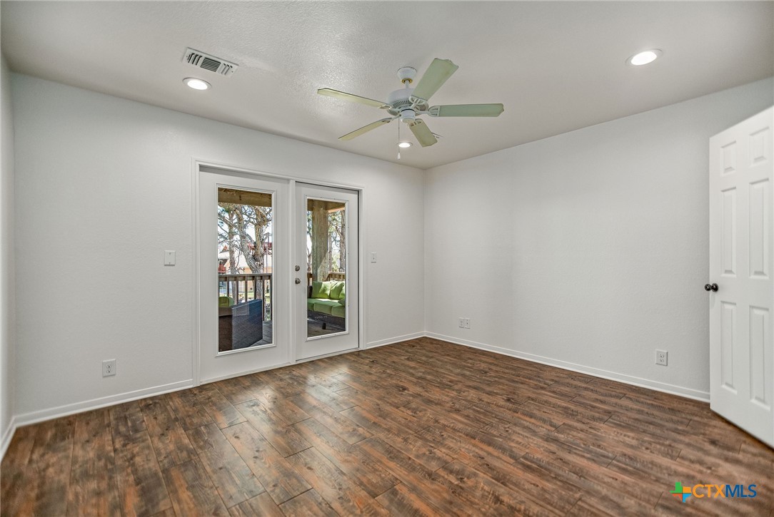 211 Taylor Avenue Port O'Connor, TX 77982 - Photo 32 of 43 a view of an empty room with a window