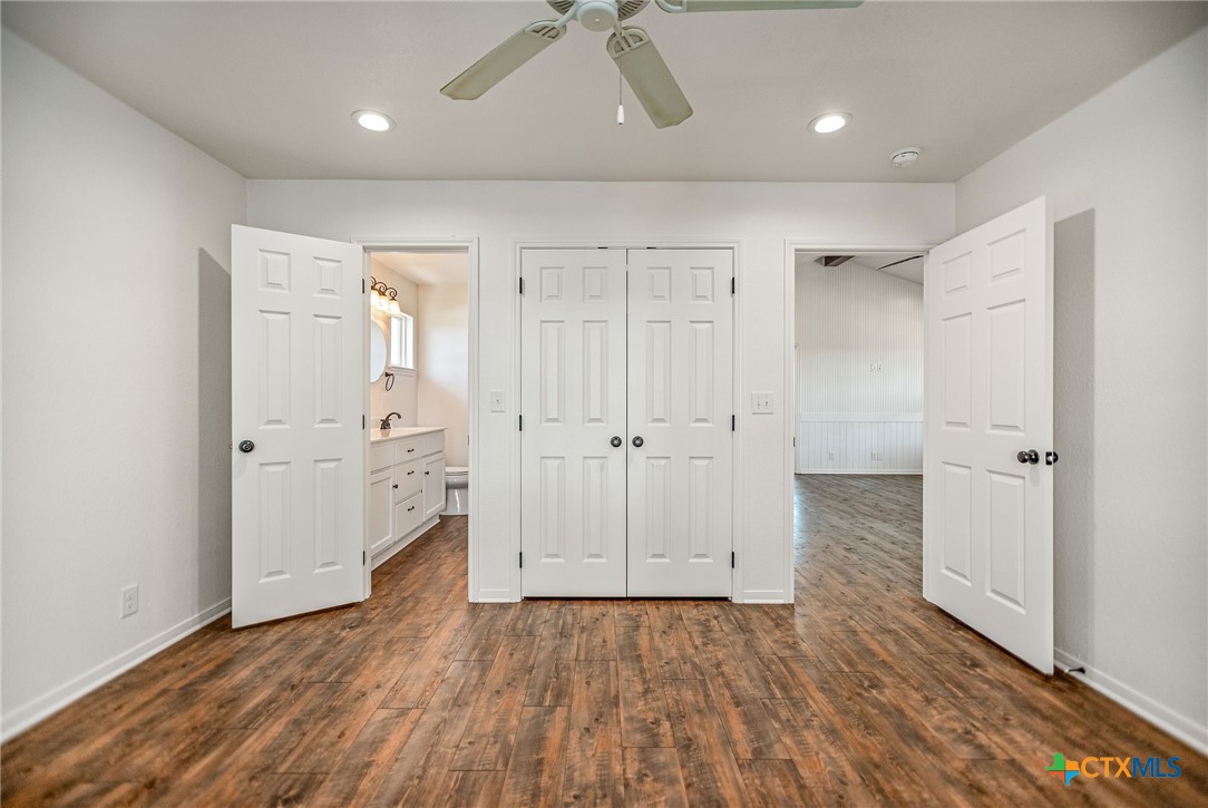 211 Taylor Avenue Port O'Connor, TX 77982 - Photo 33 of 43 an empty room with wooden floor