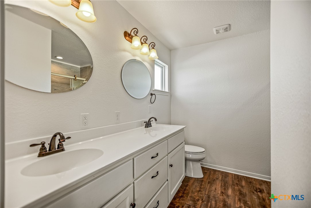 211 Taylor Avenue Port O'Connor, TX 77982 - Photo 35 of 43 a bathroom with a sink and a mirror