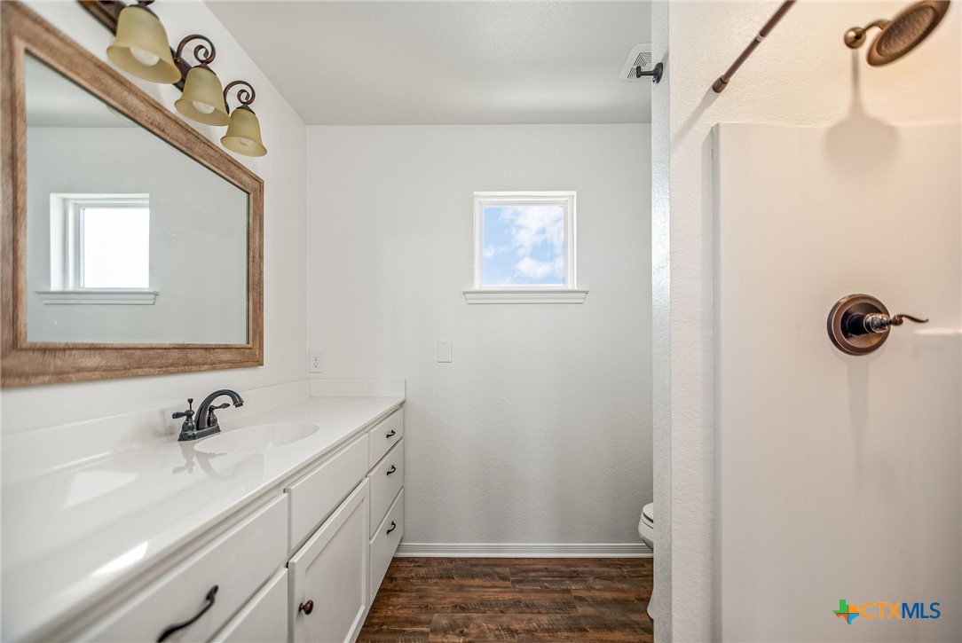 211 Taylor Avenue Port O'Connor, TX 77982 - Photo 37 of 43 a bathroom with a sink and a mirror