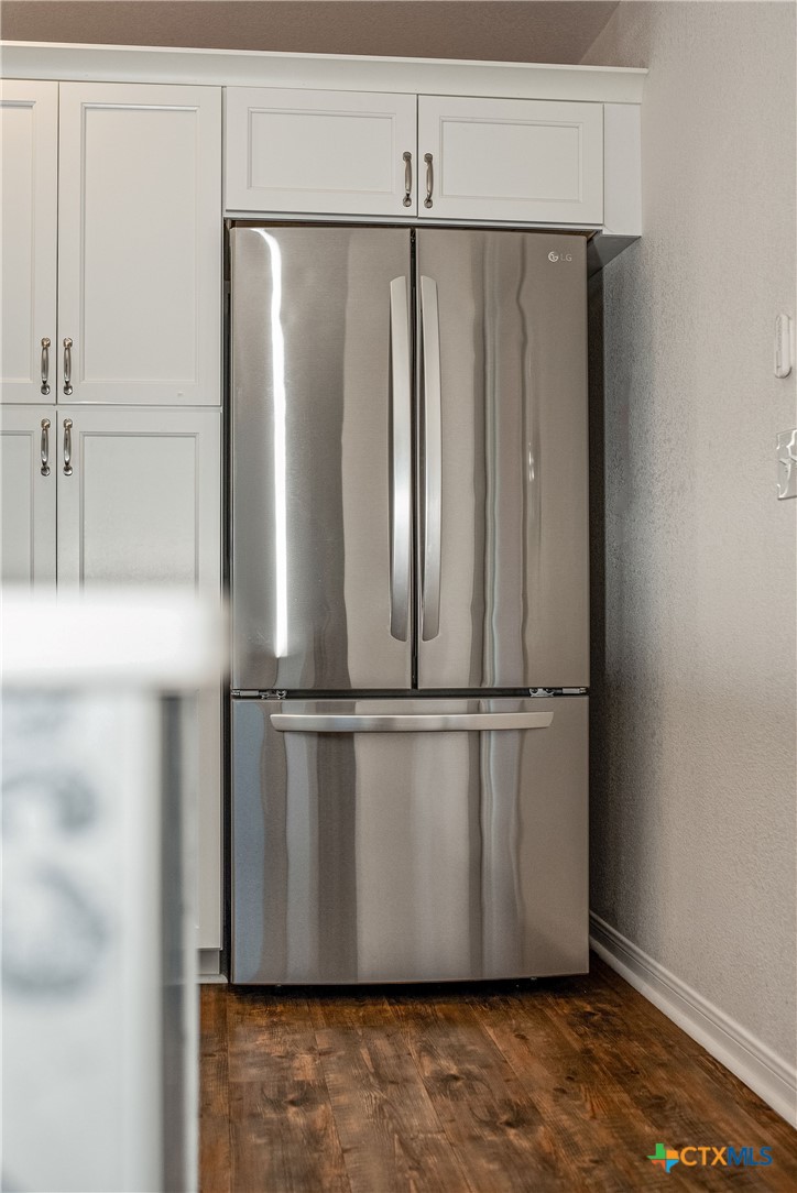 211 Taylor Avenue Port O'Connor, TX 77982 - Photo 41 of 43 a view of a refrigerator with wooden floor