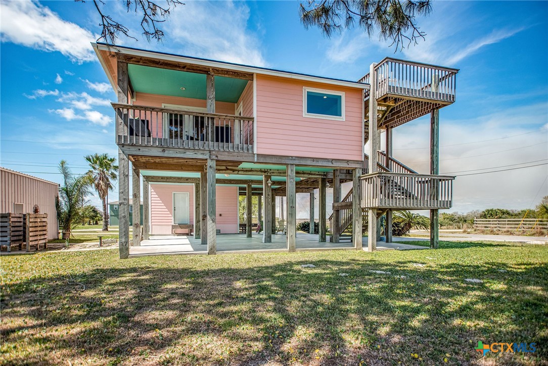 211 Taylor Avenue Port O'Connor, TX 77982 - Photo 7 of 43 a front view of a house with a yard