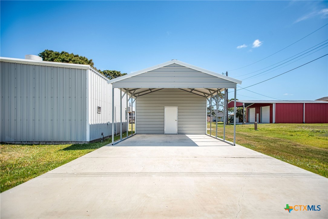 211 Taylor Avenue Port O'Connor, TX 77982 - Photo 10 of 43 a front view of a house with a garden