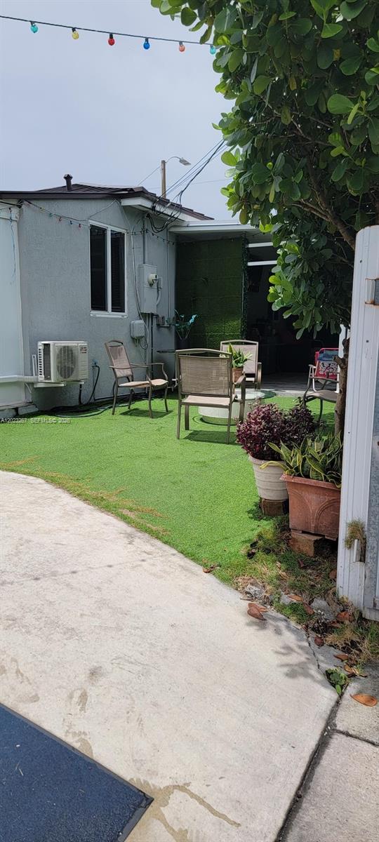 301 Southwest 36th Avenue Miami, FL 33135 - Photo 19 of 32 a view of a backyard with potted plants and a large tree