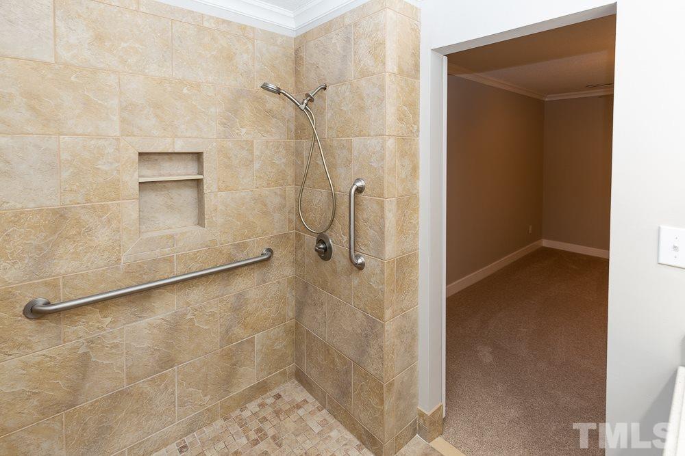 1403 Quarter Point Raleigh, NC 27615 - Photo 14 of 19 a bathroom with a glass shower door
