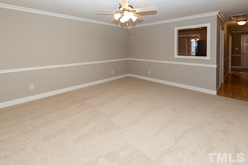 1403 Quarter Point Raleigh, NC 27615 - Photo 7 of 19 a view of an empty room with a window