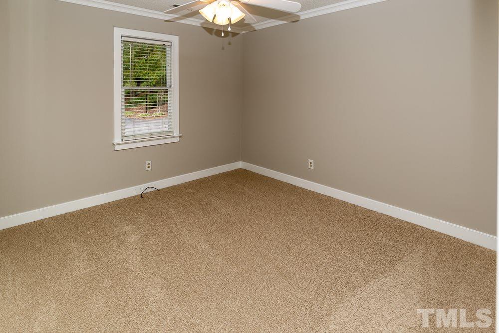 1403 Quarter Point Raleigh, NC 27615 - Photo 8 of 19 an empty room with a window