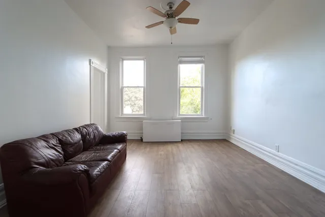 a living room with furniture and windows