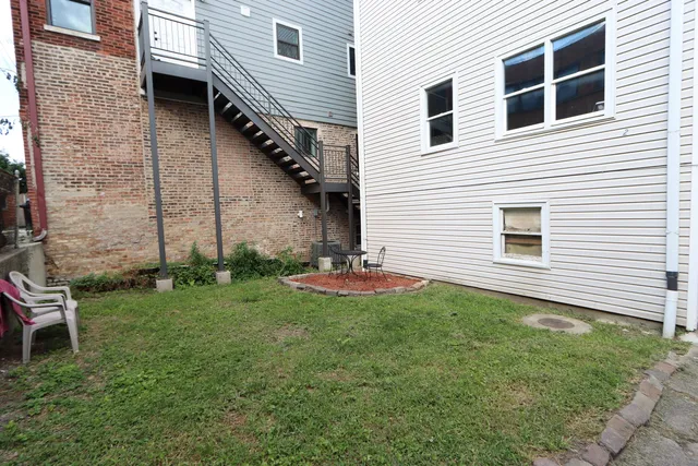 a backyard of a house with seating space