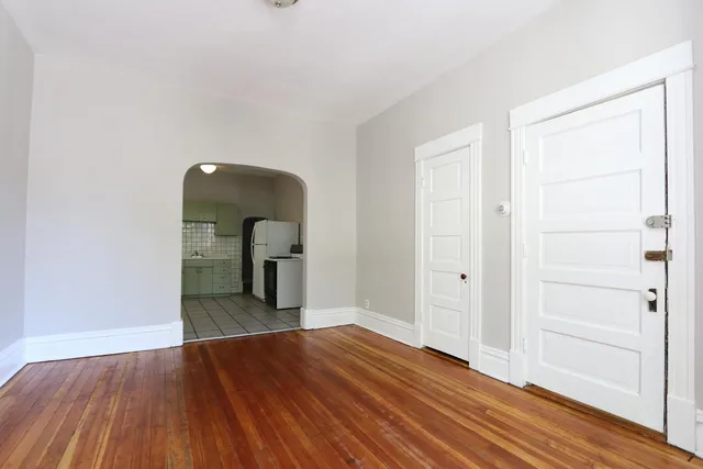 a view of a livingroom with wooden floor