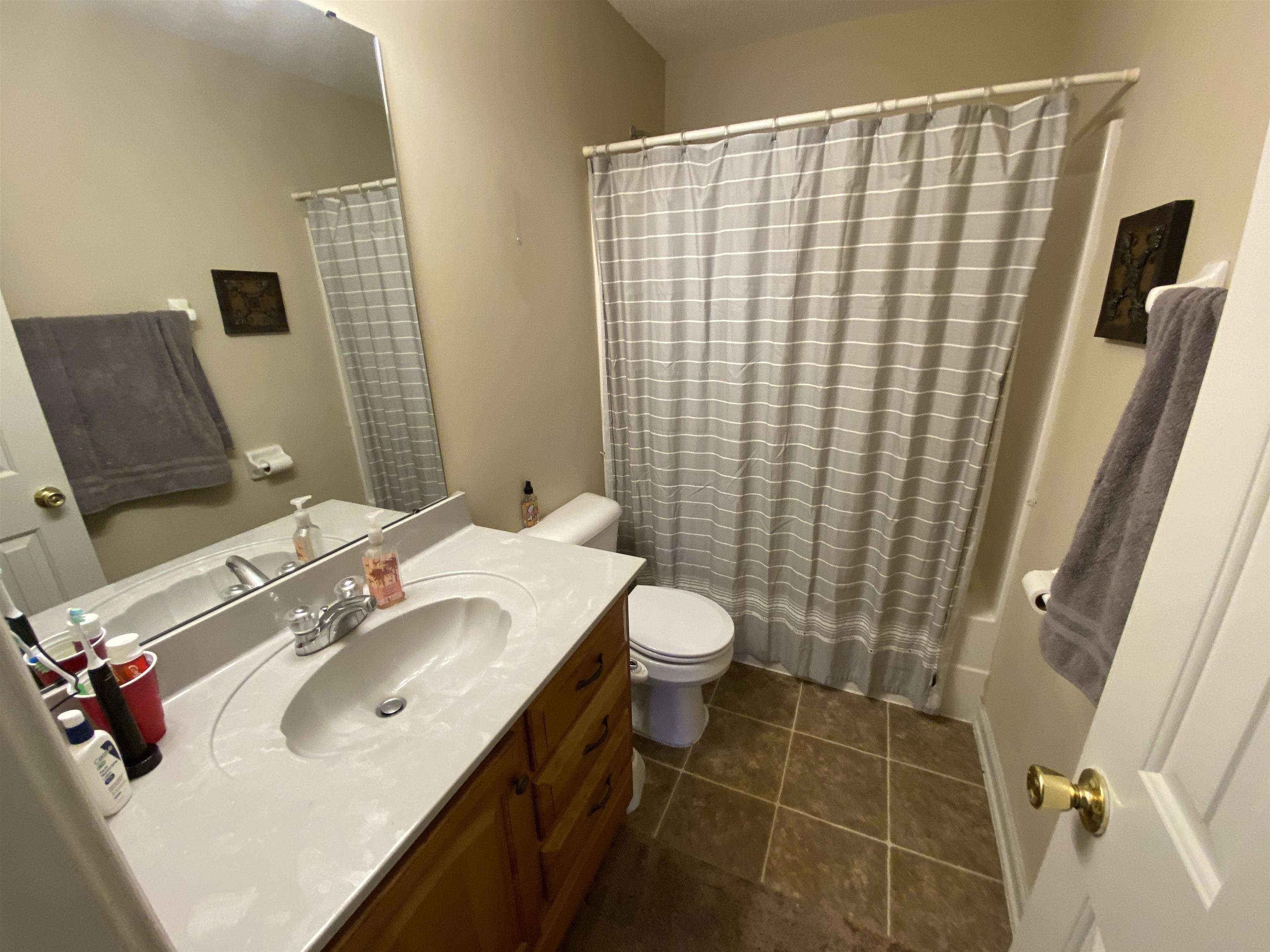5632 Sycamore Ridge Road Memphis, TN 38134 - Photo 15 of 18 a bathroom with a sink toilet and shower