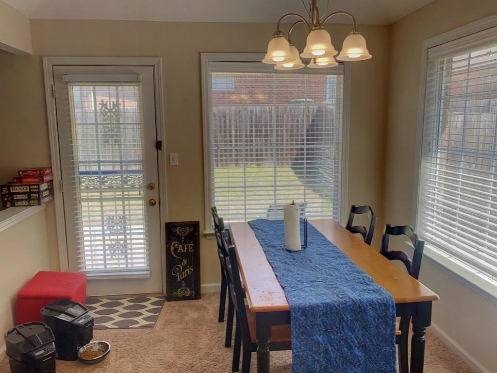 5632 Sycamore Ridge Road Memphis, TN 38134 - Photo 8 of 18 a view of a dining room with furniture and window