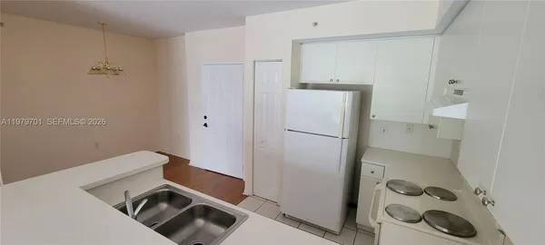 a utility room with closet dryer and washer