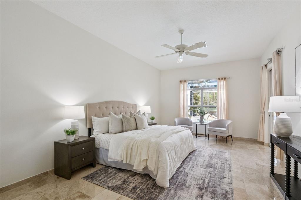2541 Teton Stone Run Orlando, FL 32828 - Photo 33 of 82 a spacious bedroom with two beds and a chandelier