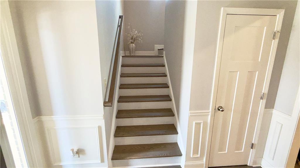 3370 Elkhorn Ridge Run Dacula, GA 30019 - Photo 2 of 29 a view of a hallway with wooden floor and entryway