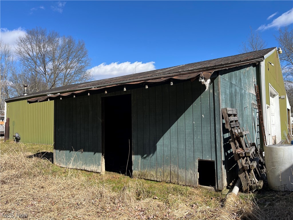 125 Porter Road Atwater, OH 44201 - Photo 22 of 22 View of property exterior featuring an outdoor structure